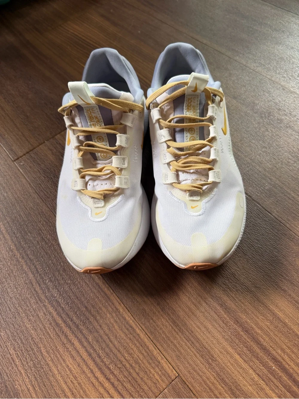 Nike Kids White Sneakers with Pale Yellow Accents